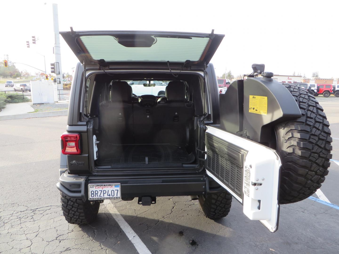 2020 BLACK /BLACK Jeep Wrangler Unlimited Rubicon (1C4HJXFGXLW) with an 3.6L V6 DOHC 24V FFV engine, 6A transmission, located at 2630 Grass Valley Highway, Auburn, CA, 95603, (530) 508-5100, 38.937893, -121.095482 - STANDARD CONTENT AEV RX Front Bumper AEV Front Skid Plate AEV Non-Winch Cover Plate AEV 7000 Series Lights AEV Light Cover Kit AEV 2.5" DualSport RT Suspension System AEV Front Geometry Correction Brackets AEV Steering Stabilizer AEV Rear Bumper AEV Swing-Out Tire Carrier AEV CHMSL Mount - Photo#61